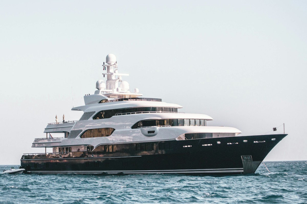 Ritz-Carlton Yacht Collection Evrima luxury yacht anchored off the coast of Monaco