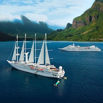 Windstar Cruises luxury sailing yacht cruising in French Polynesia turquoise waters